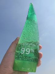 Aloe Gel Skin Care Moisturizing Face Cream bottle with 99% Aloe Vera, held against a blue sky.